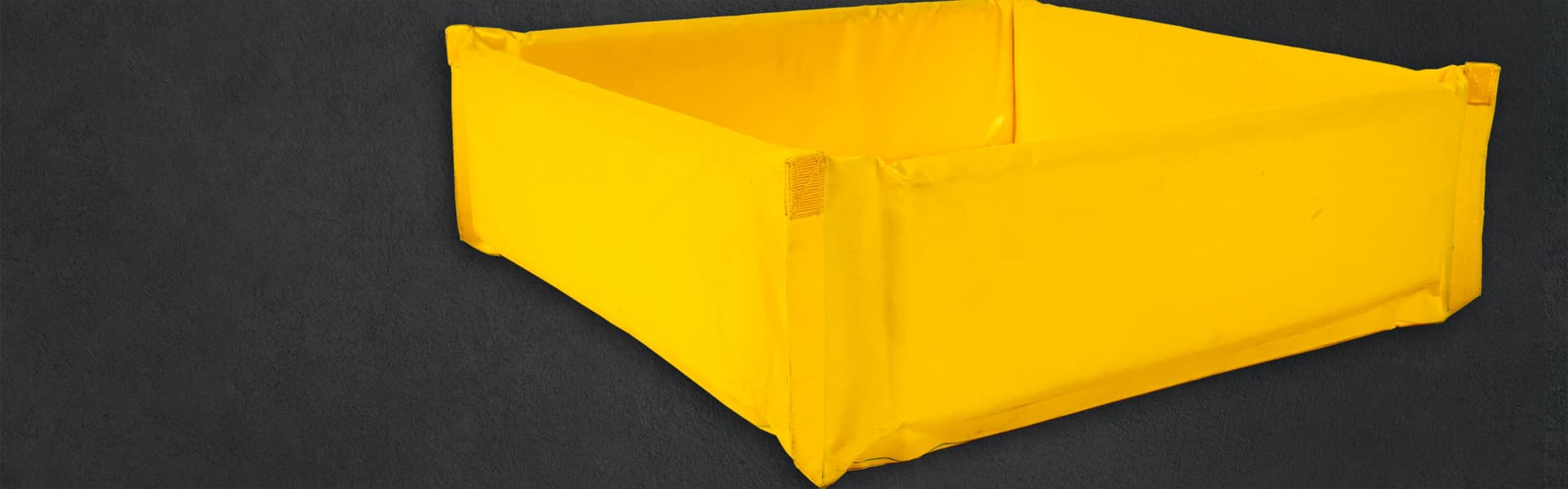 portable secondary containment berm black background